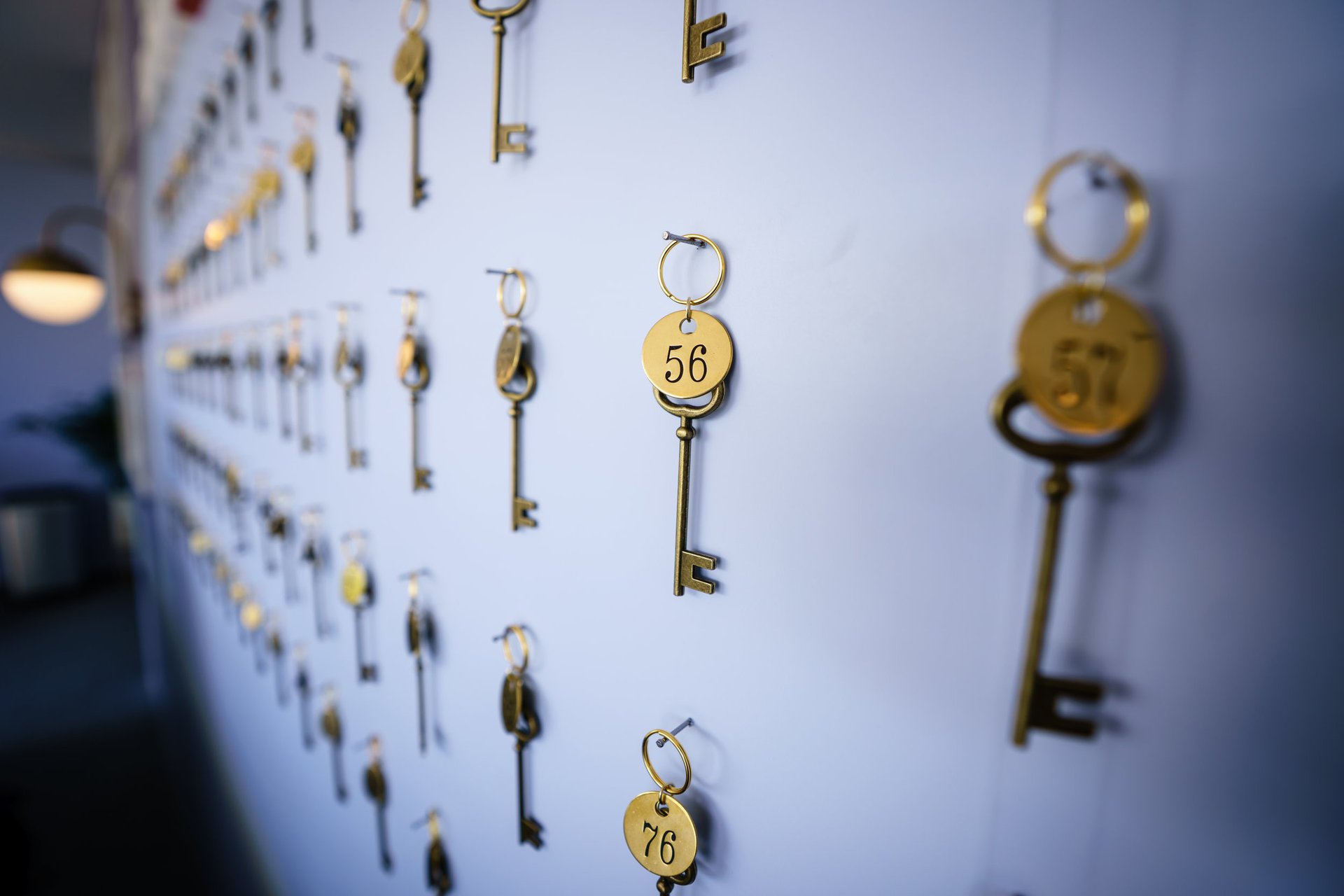 The event put on by Crush Studio featured a hotel check-in desk, complete with property images and a beautiful gold key display.