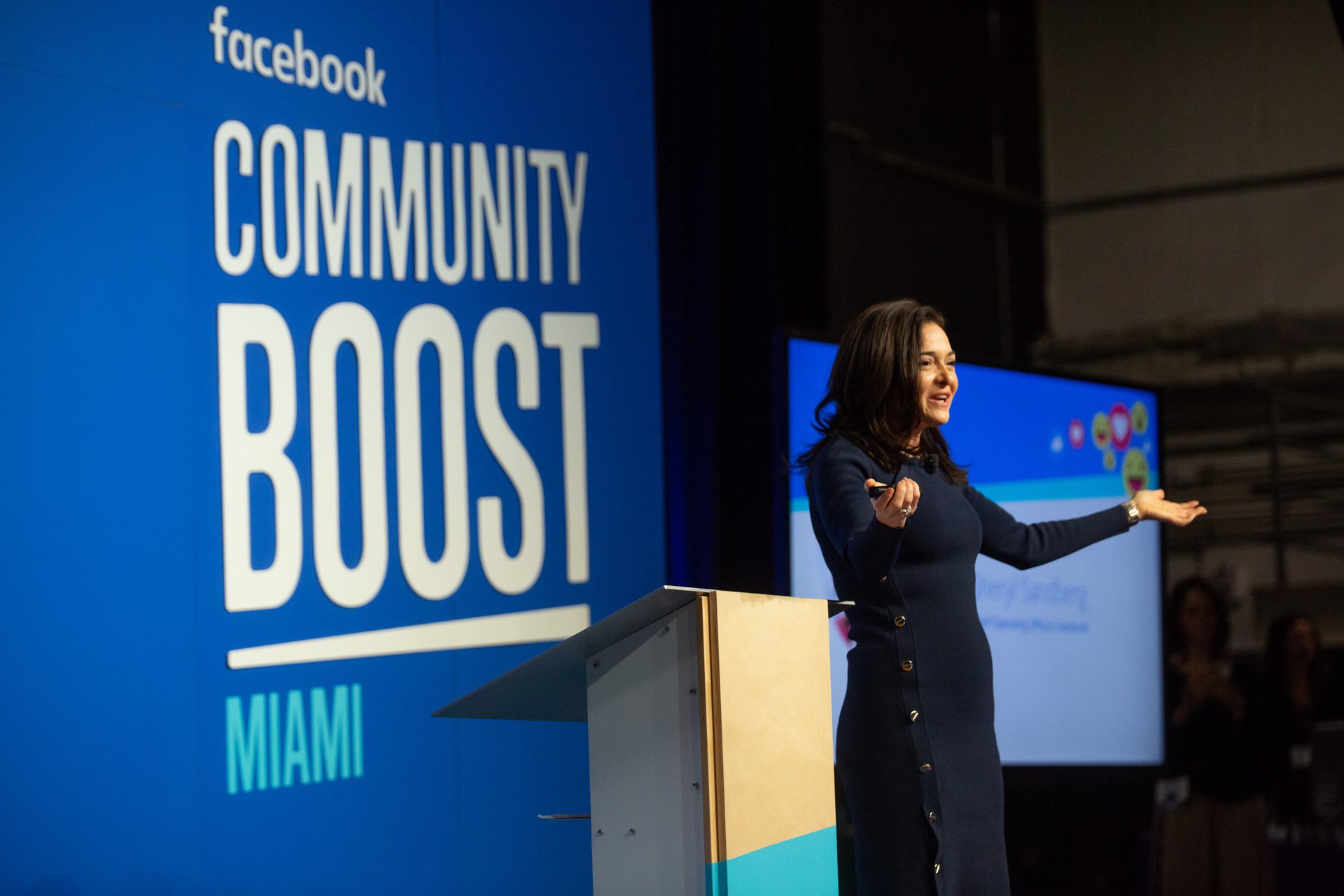 Sheryl Sandberg addresses the crowd in Miami at Facebook Community Boost.