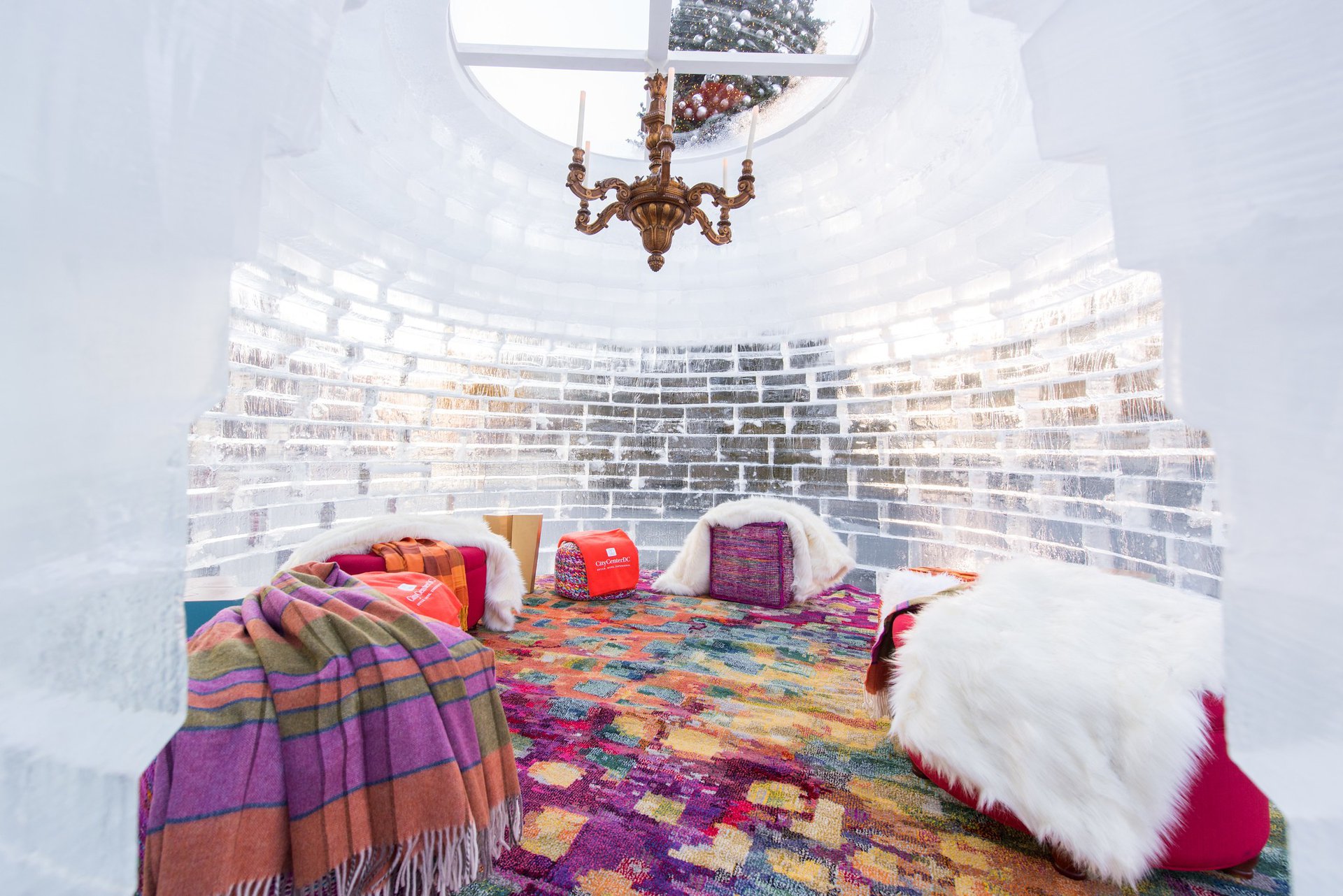 Beautiful furnishings and a chandelier inside an igloo at City Center DC. 