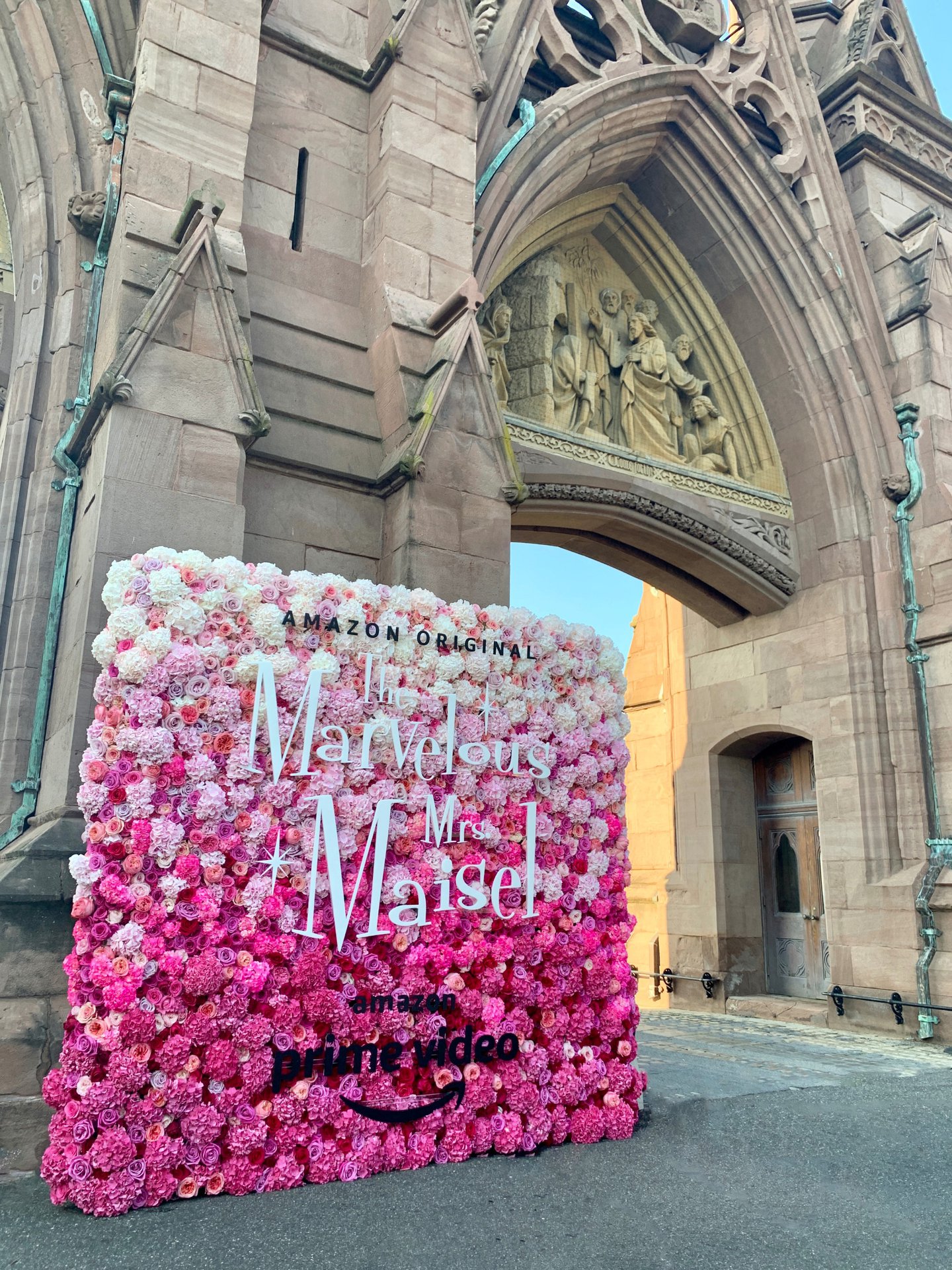 A perfectly pink ombré flower wall turned heads at an outdoor screening of Amazon Prime Video's hit series The Marvelous Mrs. Maisel at Green-Wood Cemetery. 