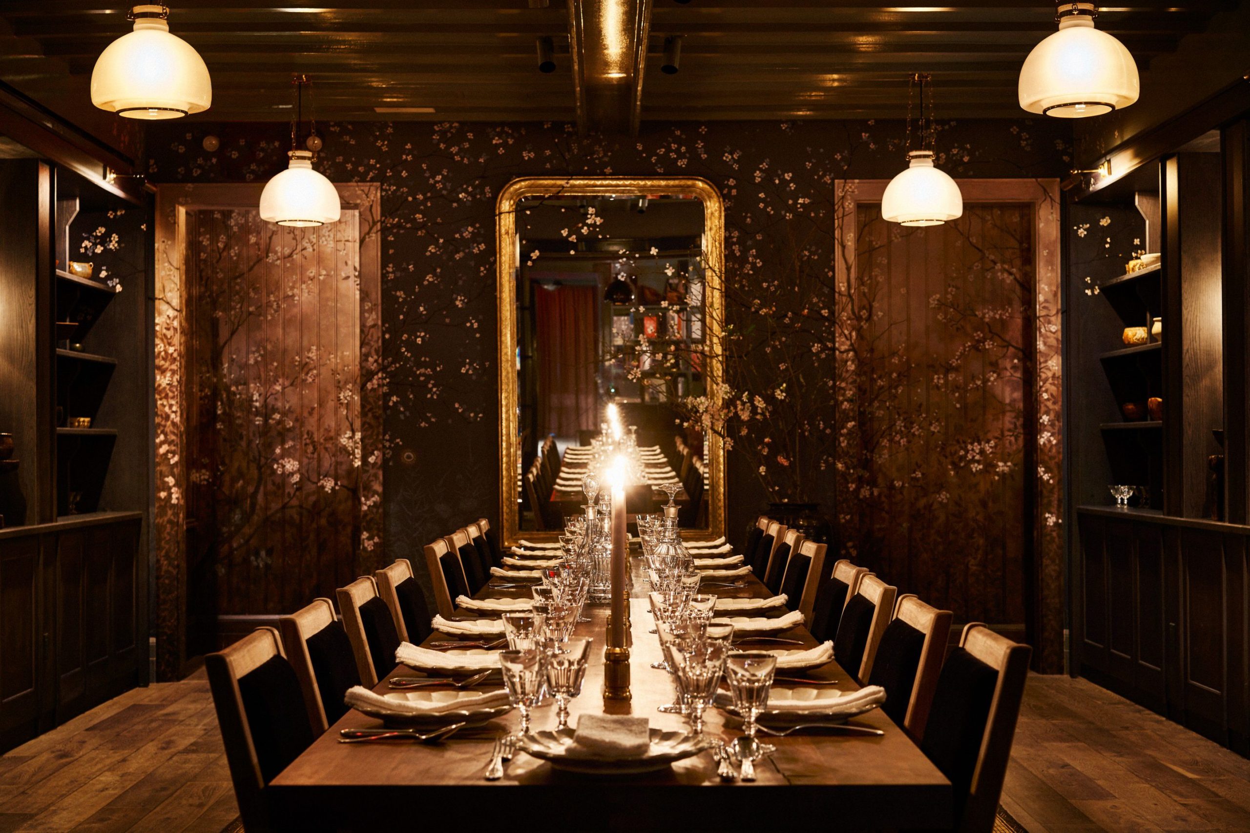 Long wooden dining table in a cave like room