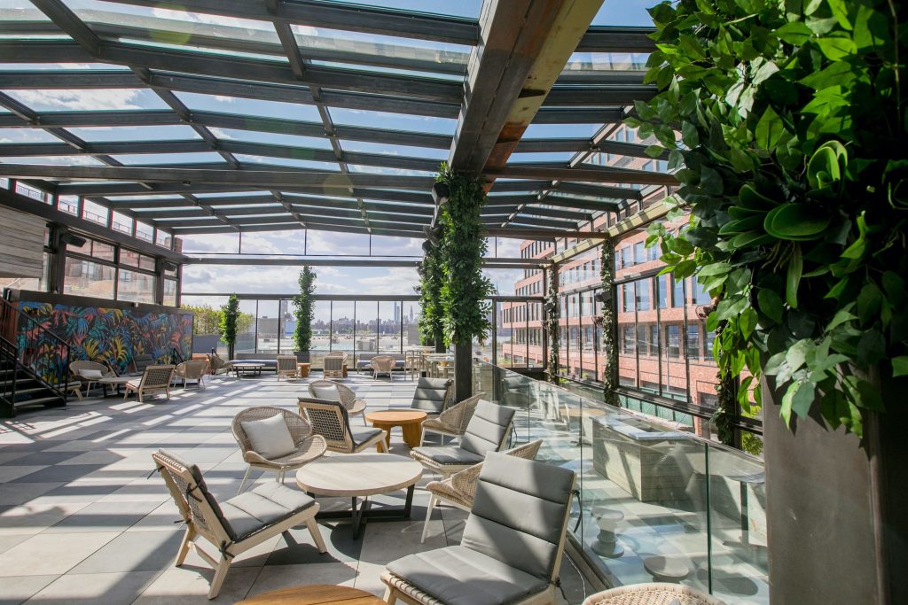 Large rooftop venue with a glass greenhouse ceiling