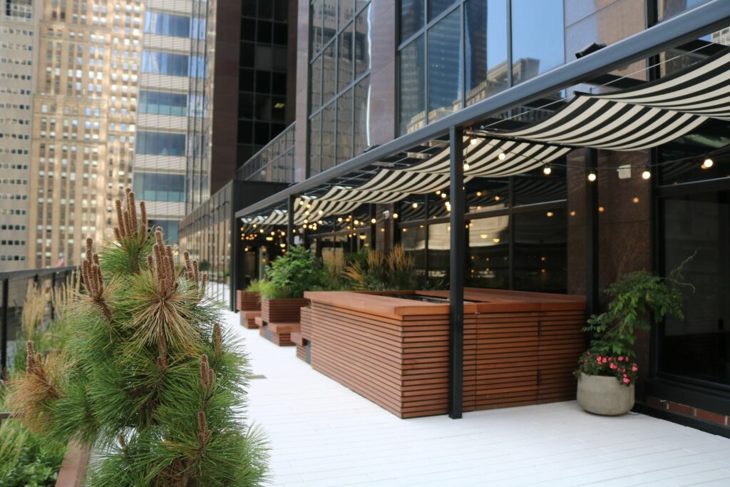 Outdoor roof space with black and white striped awning