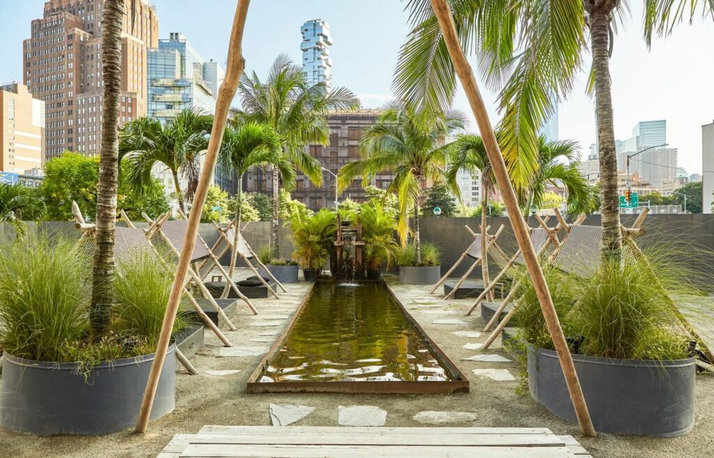 Outdoor space with water feature and palm trees