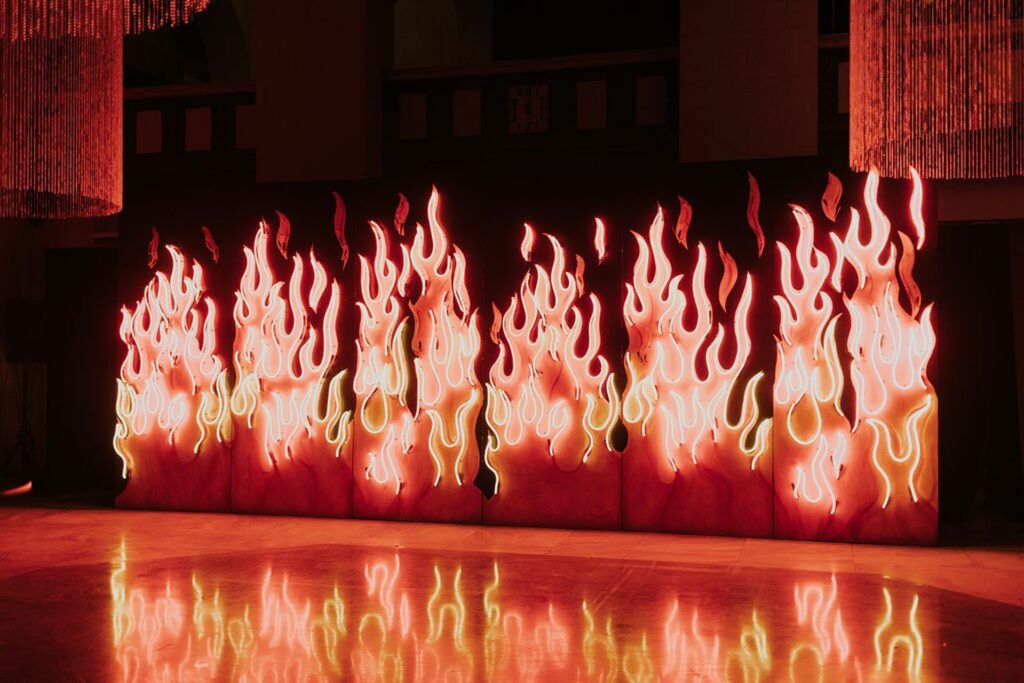 Neon lit backdrop of fiery flames
