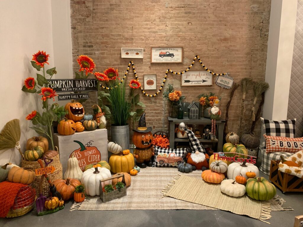 A large display of pumpkins an drugs and other Halloween and fall decor