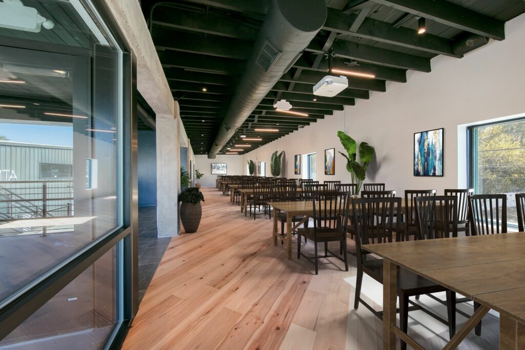 A minimalist restaurant in Austin with simple tables and chairs