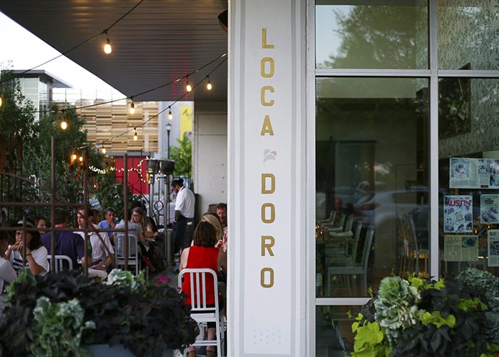 Outside a restaurant that says Loca Doro