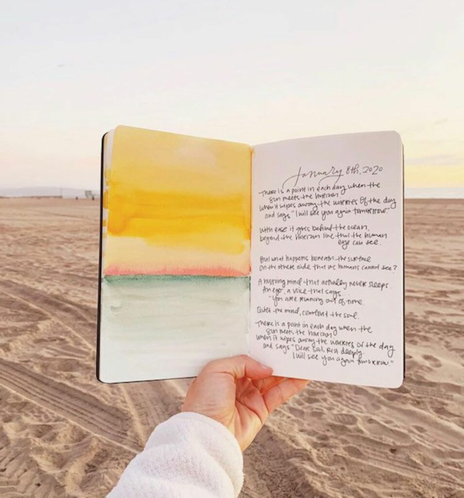 Journal open on the beach