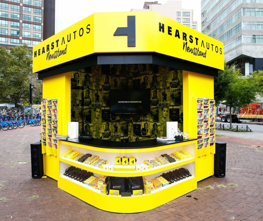 A bright yellow newspaper stand