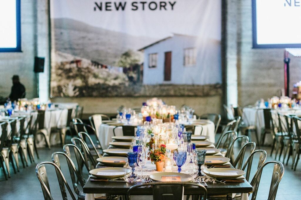 Long barn tables with blue and natural place settings