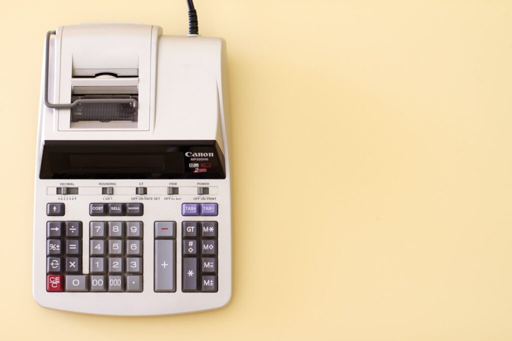 Ten key accounting calculator on yellow desk