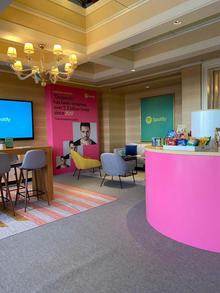 Lounge area with pink reception desk