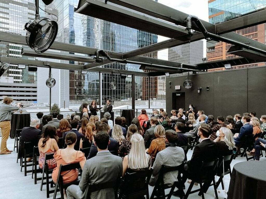 A rooftop covered with a glass ceiling in the middle of downtown Austin