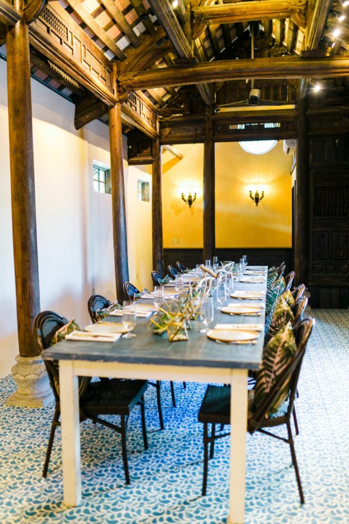 Long dining table in restaurant with tiled floor