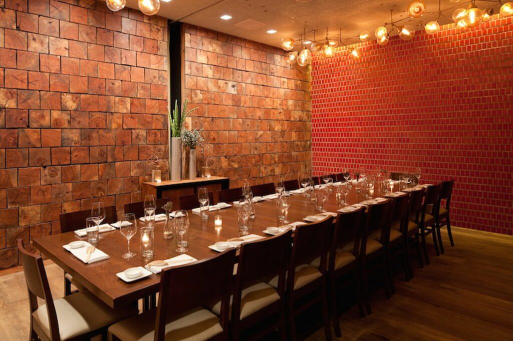 Long dining table in a red and brown rom