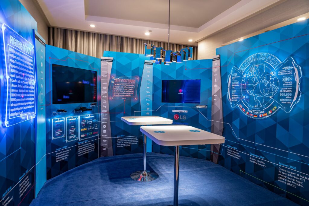 Blue booth with high tech walls and blue carpet