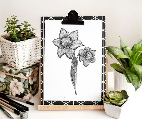 a drawing of a flower displayed next to plants