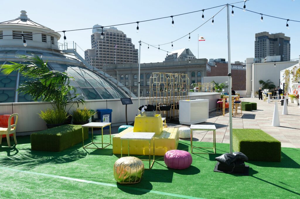 Rooftop bar with astroturf looking out on buildings
