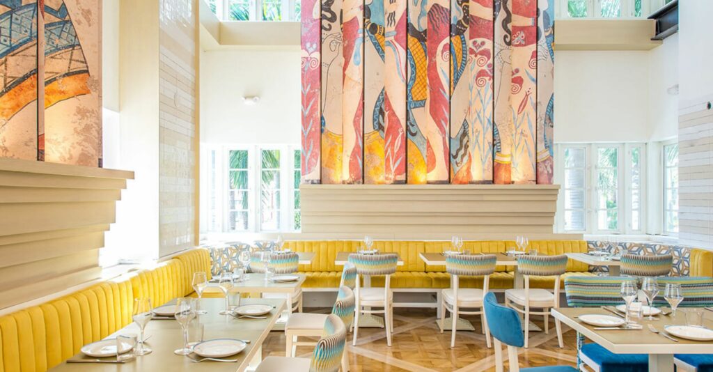 Bright colorful restaurant with large murals