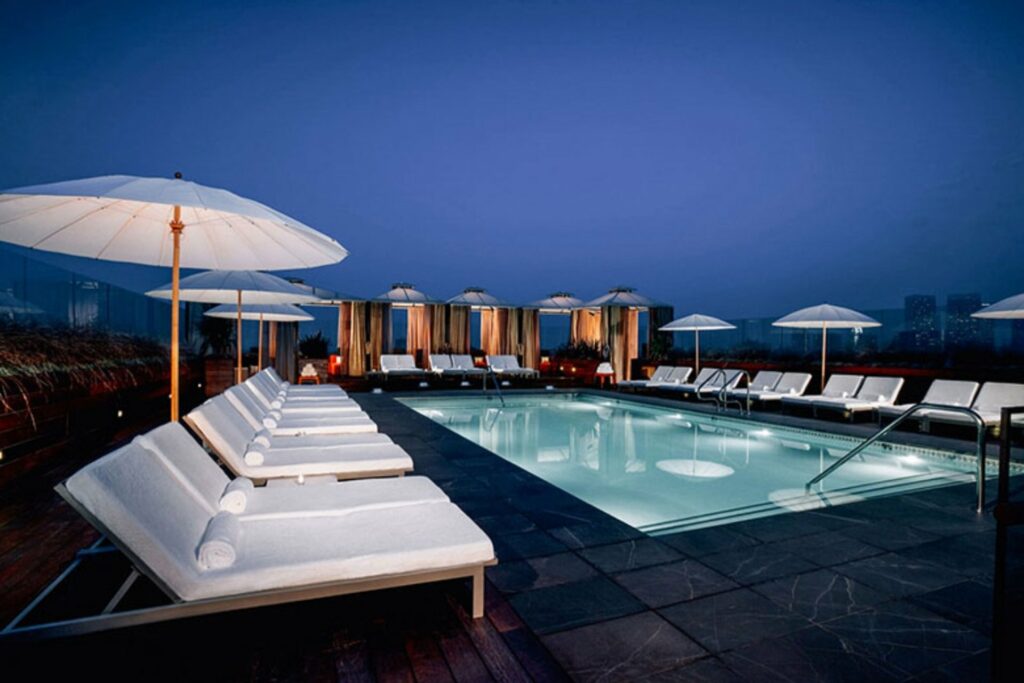 The Above Sixty in Beverly Hills hotel pool at night 