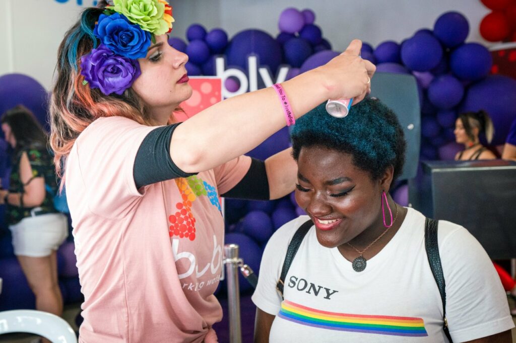 LA Pride event with girl's hair being spray painted