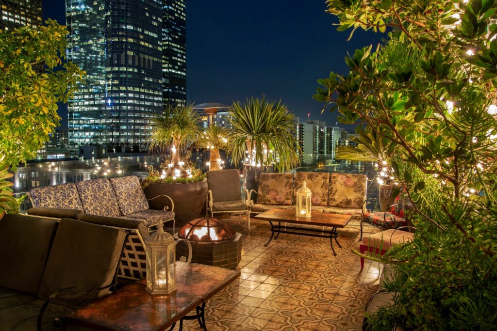 Perch, a Los Angeles rooftop at night with lush plants and outdoor lights