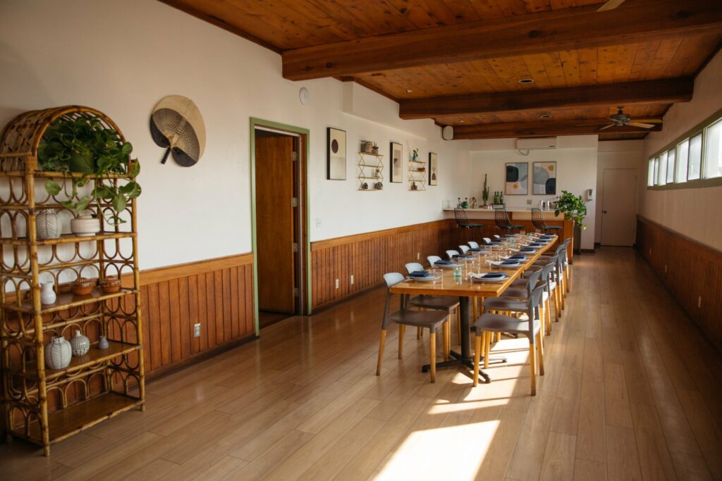 Tallula's private dining room in Los Angeles with wooden table, chairs, and wooden room trim