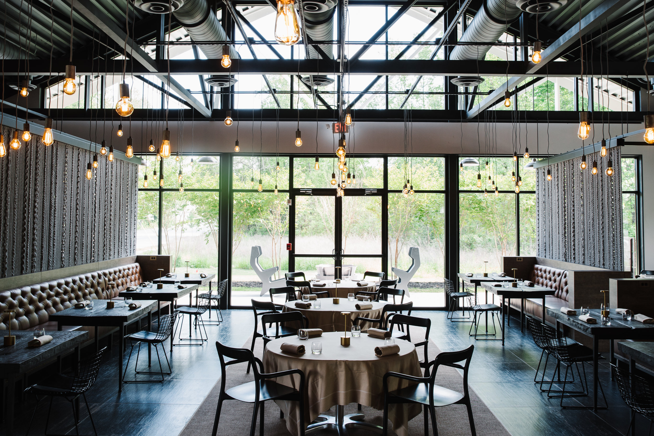 Dining space with high ceilings and a lot of light