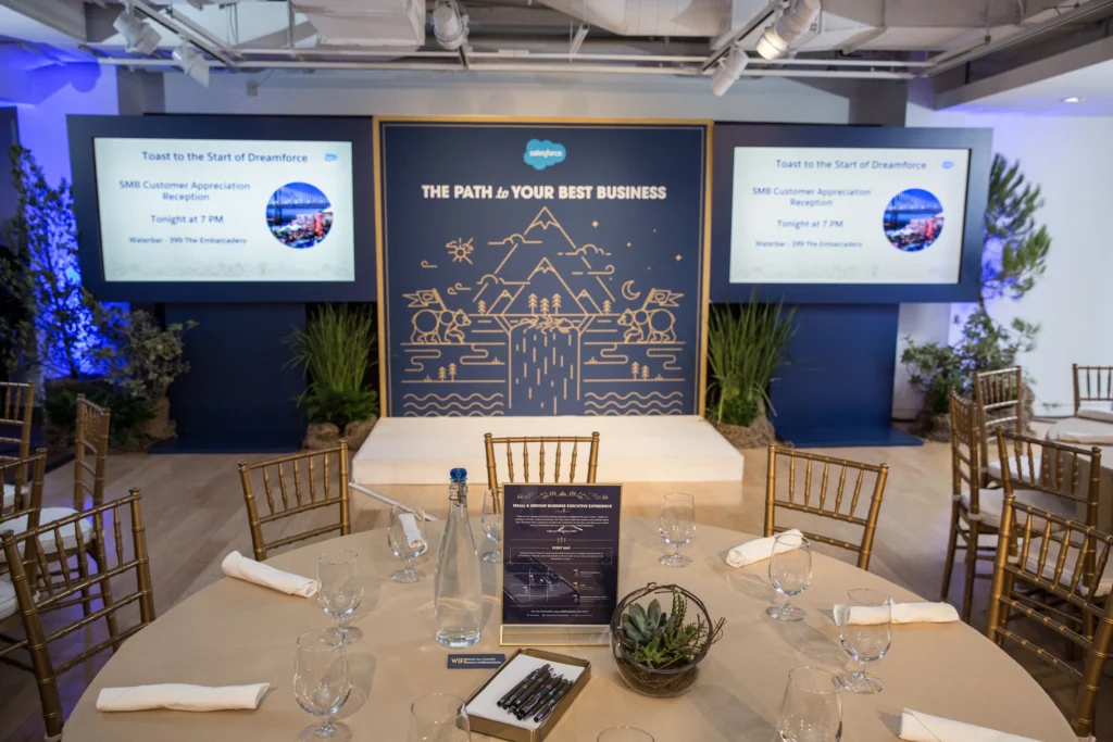 Tables and signage set up for a Salesforce event