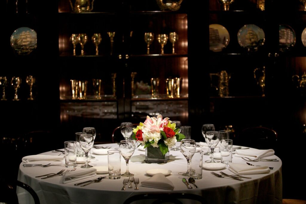 Table with colorful flower arrangement at the Old Ebbitt Grill 