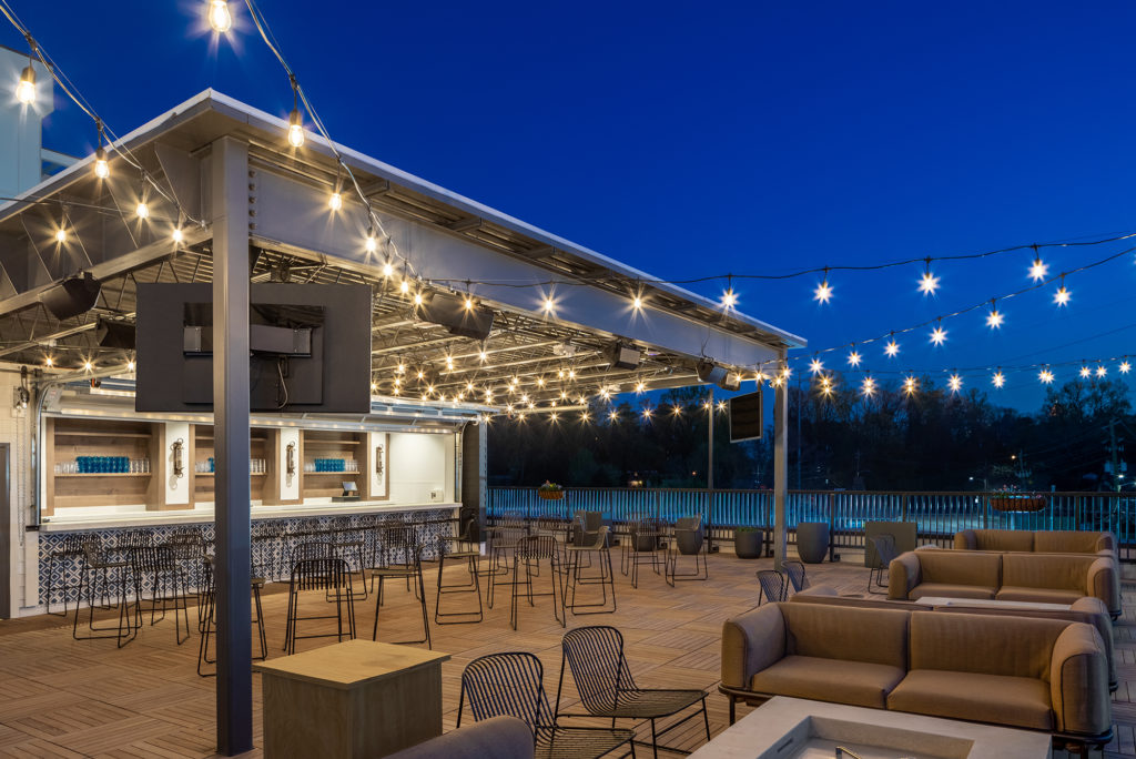 Grana Atlanta rooftop at night with string lighting