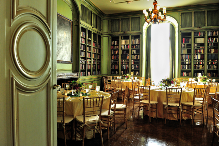 Event space at Meridian House with walls lined with books