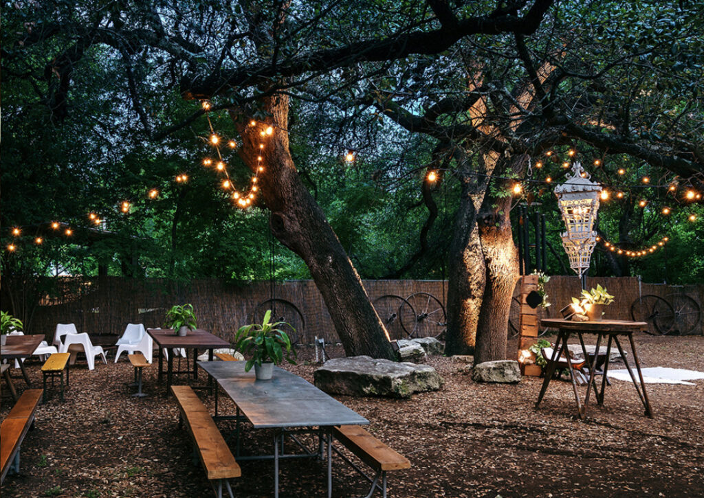 Vuka Austin outdoor creek venue with string lights