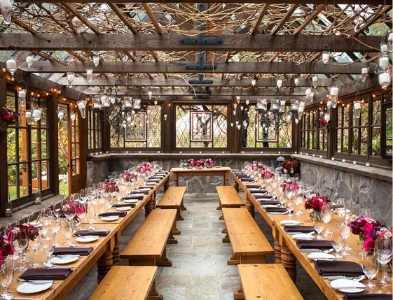 Bella Luna Farms in Seattle in an open greenhouse structure with vines and string lighting