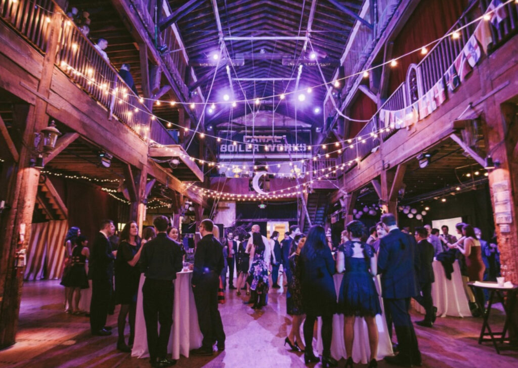 Emerald City Trapeze with high ceilings and string lights