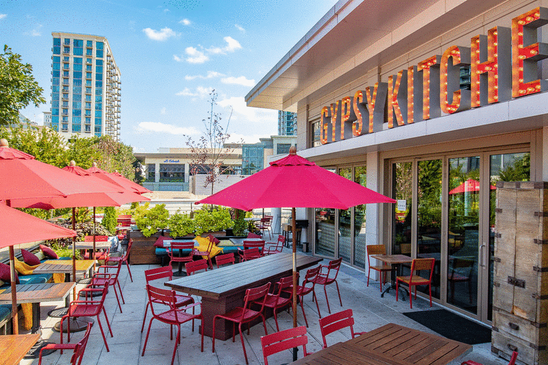 Gypsy kitchen Atlanta Rooftop outside patio with red umbrellas