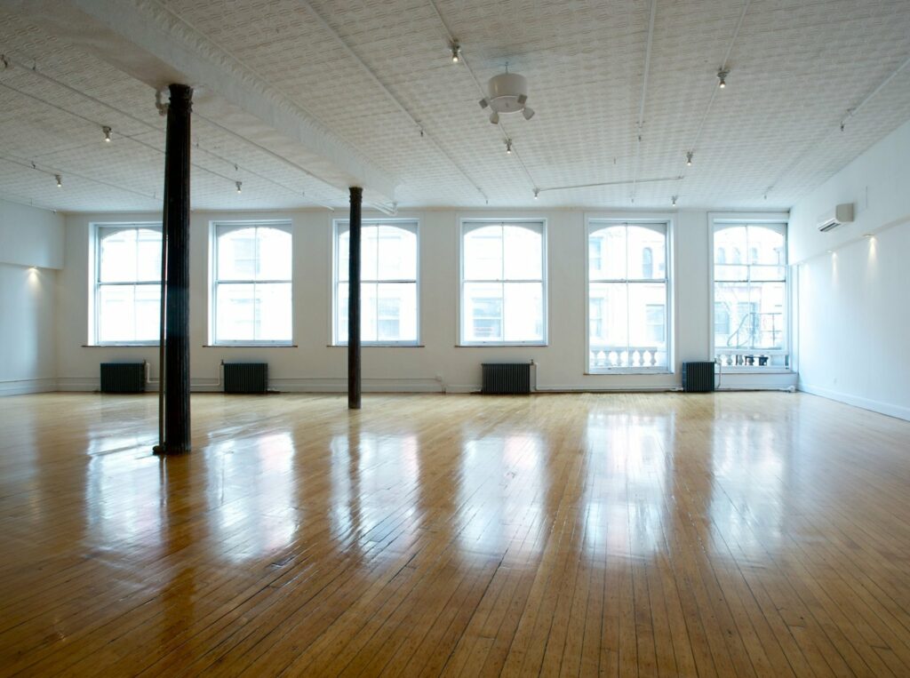 Home Studios in NYC with big windows and wooden flooring