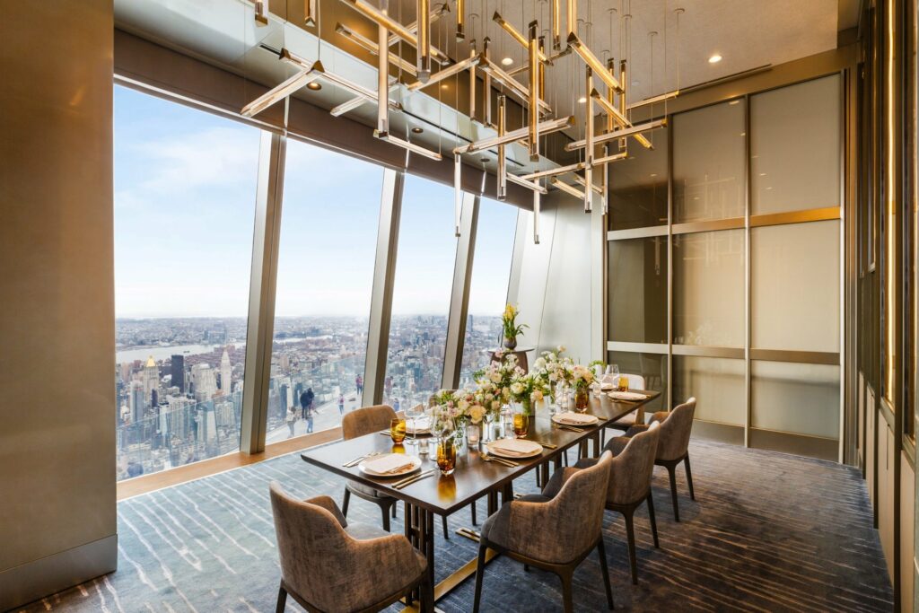 Peak dining room with window view of Manhattan