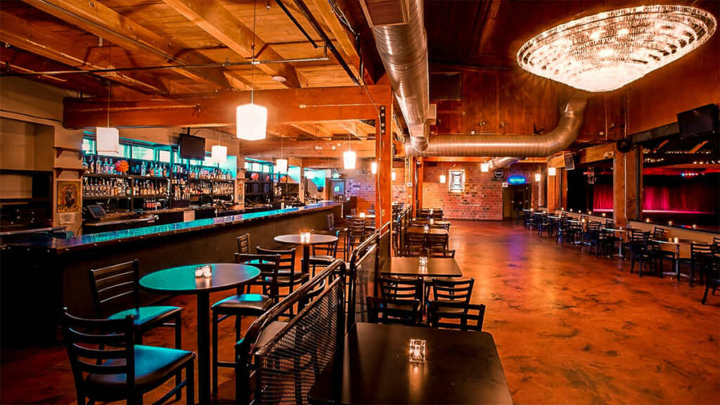 Showbox in Seattle with industrial flooring and many tables and chairs