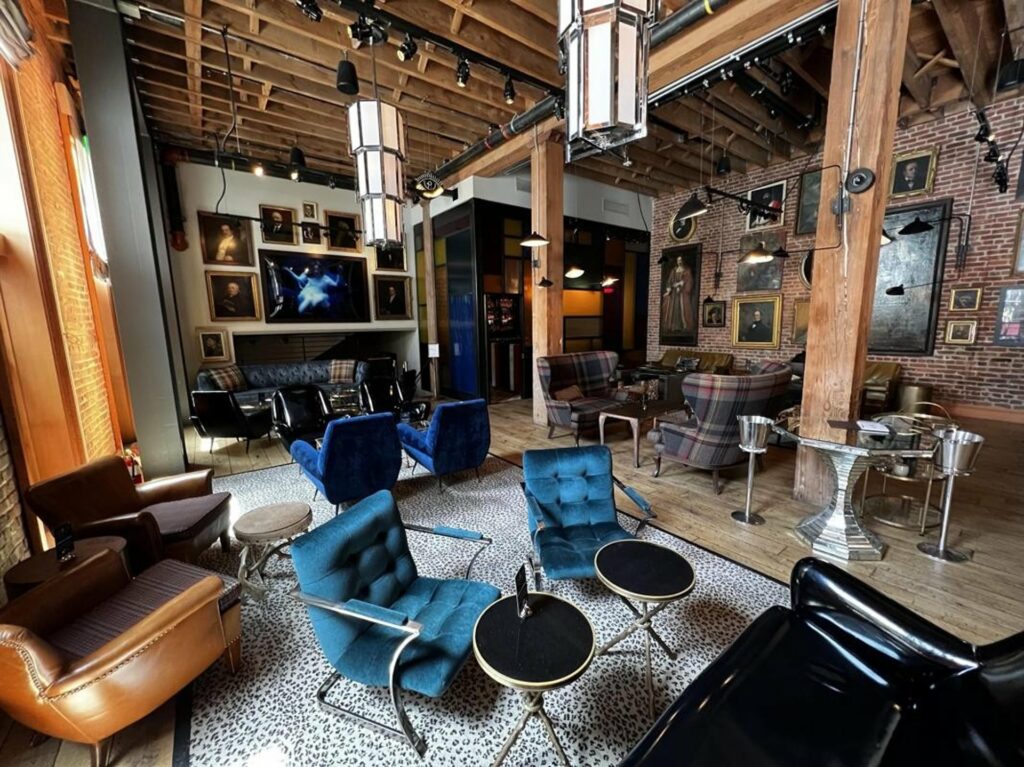 Industrial chic interior of The Battery in San Francisco with high ceilings and wooden beams