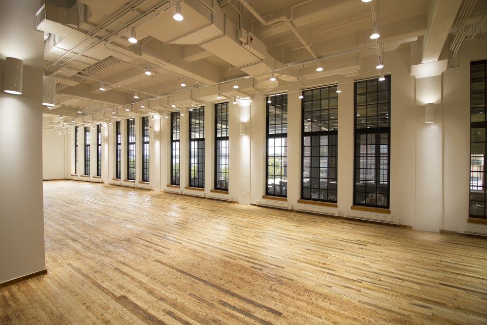 West Edge in NYC with tall windows and wooden flooring