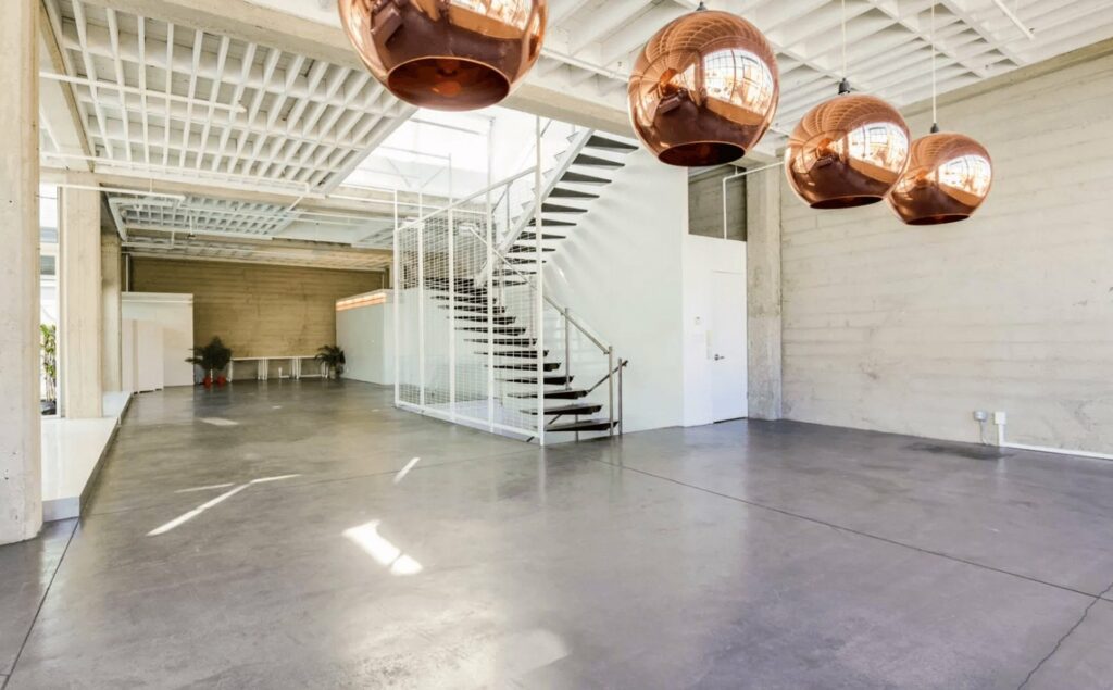 Alloy Collective San Francisco large raw event space with chrome globe ceiling lights