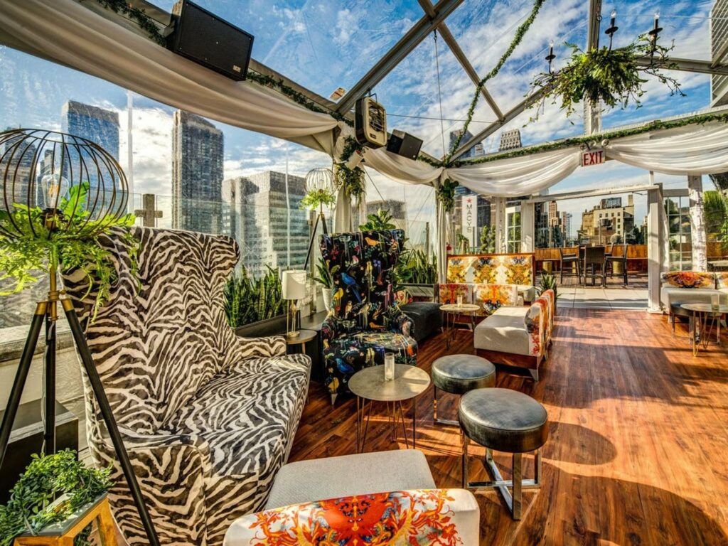 Monarch Rooftop in midtown boasting a skylight roof and funky printed furniture. 