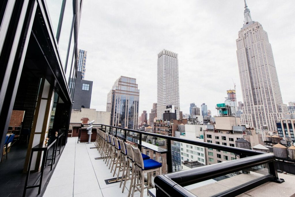 Spyglass rooftop bar in NYC with views of the city and the Empire State Building