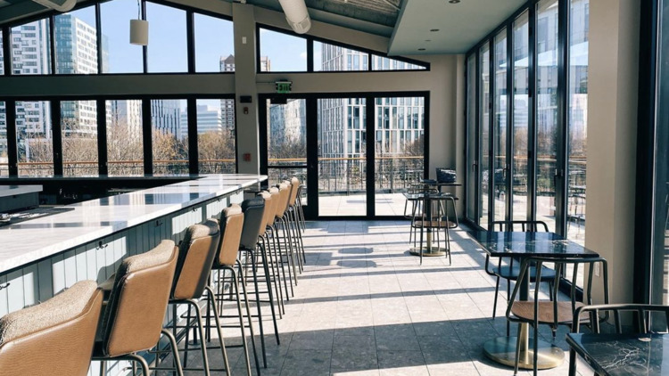 The Lexington Rooftop in Boston with floor to ceiling windows and an indoor and outdoor rooftop area