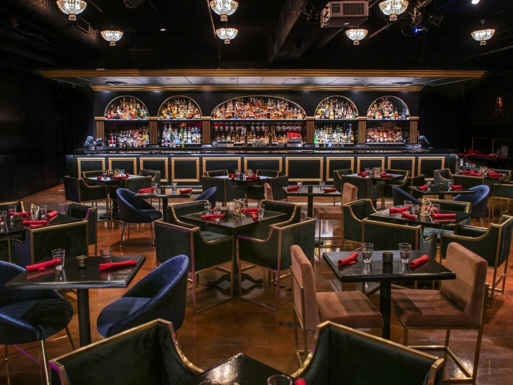 Untitled Supper Club in Chicago with mood lighting and a bar with dark finishings