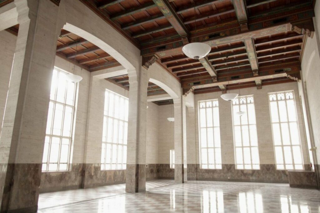 Alfred I. Dupont building in Miami with large windows and marble flooring. 