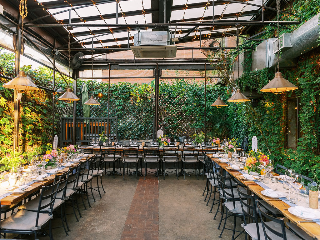 Aurora Brooklyn outdoor covered dining area with grass walls