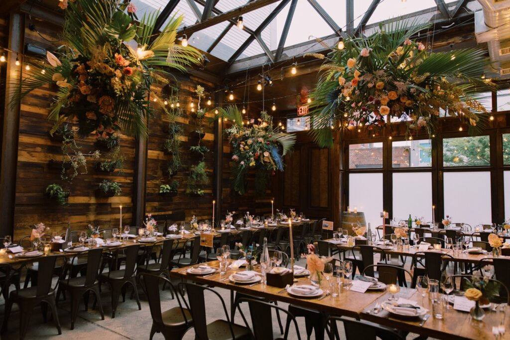 Brooklyn Winery dining room with barn wood walls, hanging succulents,
